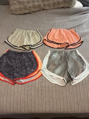 Bundle of 4 Nike women’s running shorts size Large LIKE NEW